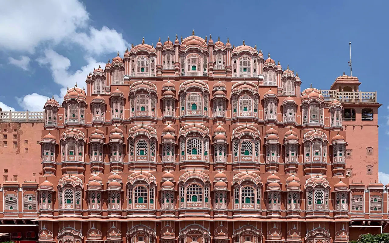 The pink facade and rows of windows of Hawa Mahal in Jaipur